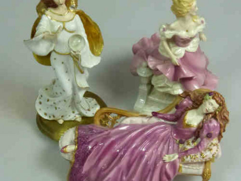 Three Porcelain Figurines 'Sleeping Beauty', 'Cinderella' and 'Destiny'