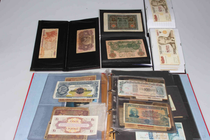 Four albums of worldwide banknotes. Predominantly pre-WWII German (Reichsbanknote Dwanzig Mark inc 1902, 1910, 1914, 1915, 1920, 1923), Bank of England One Pound Peppiatt, Russian, Spanish, French, British Armed Forces (special vouchers, 5p, 10p), Mozambi