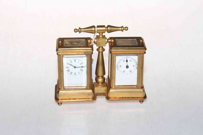 French gilt brass miniature carriage clock and barometer desk piece, having bevelled glass sides, 12cm across, 10cm high including handle.