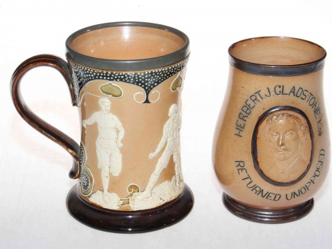 Doulton Lambeth stoneware 'sporting' mug with relief decoration, 15cm,...