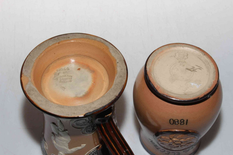 Doulton Lambeth stoneware 'sporting' mug with relief decoration, 15cm, together with Gladstone Leeds Election 1880 baluster beaker (2).