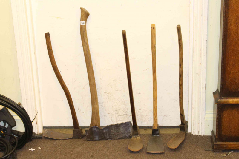 Four vintage picks and axe.
