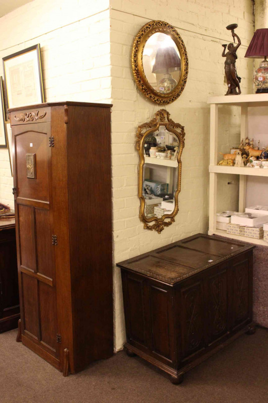 Oak hall wardrobe, carved oak blanket box and two gilt framed wall mirrors (4).