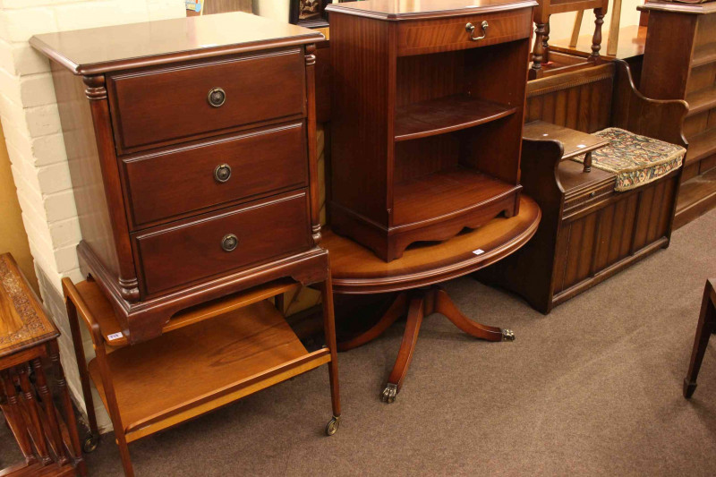 Three drawer pedestal chest, teak trolley, Strongbow side cabinet, oval coffee table, telephone seat and two vintage cases (7).