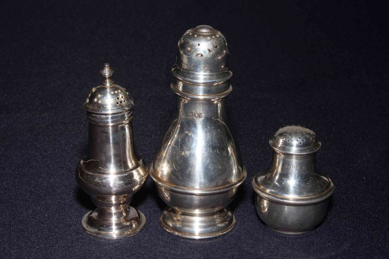 George III silver pepperette, makers mark EM, London 1759, Victorian silver caster, London 1899 and small silver pepperette (3).