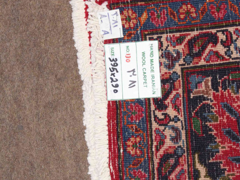 Large hand made Iranian red ground carpet from the Mashad region, 395 by 290cm. thumbnail
