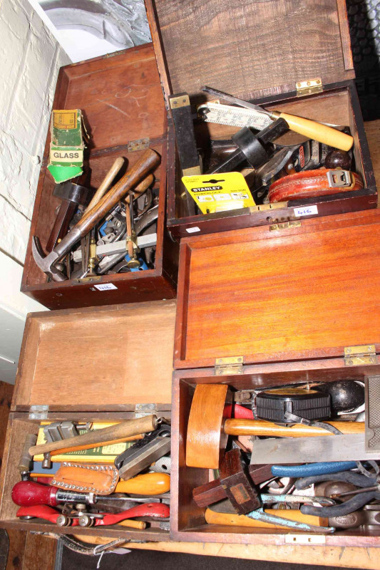 Four small boxes of tools including spoke shaves, planes, measures, gauges, etc.