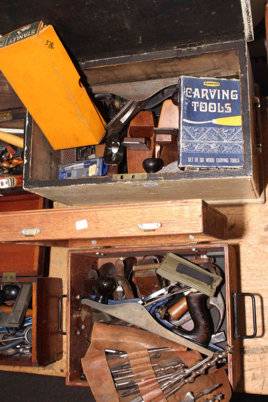 Two boxes of planes and carpentry tools.