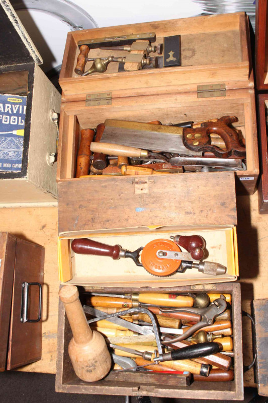 Four boxes of wood chisels and carpentry tools.