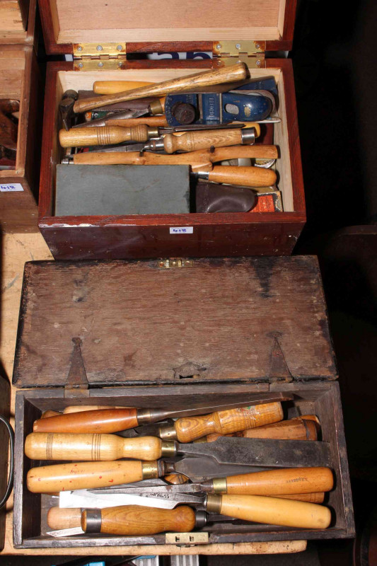 Four boxes of wood chisels and carpentry tools.