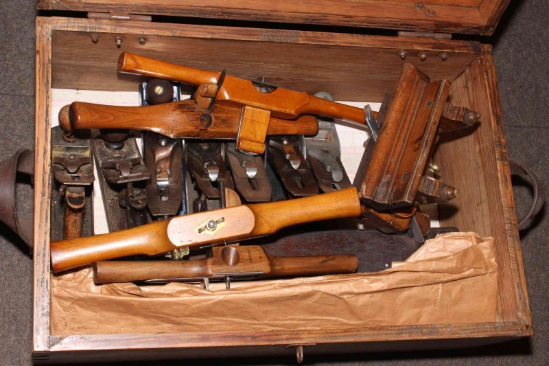 Tool box containing planes and shaves.