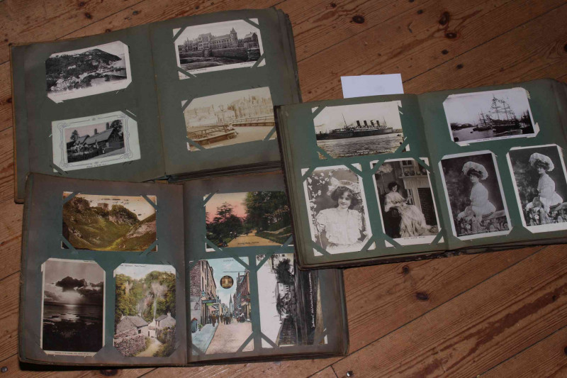 Four very nice albums of postcards including Figure 8 Railway Spanish City Whitley Bay RP 1909, Cullercoats Fisherfolk and fisherwomen, Mauretania 1908 RP, Monkseaton brewery, Ann Hathaway's Cottage woven silk, view from Pier Aberystwyth 1904 RP, The Whit
