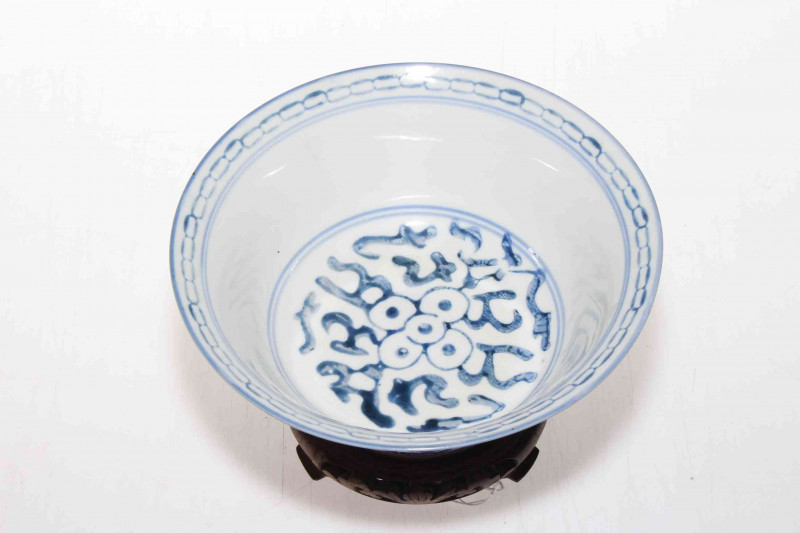 Chinese blue and white bowl with carved wood stand, 16.5cm diameter.