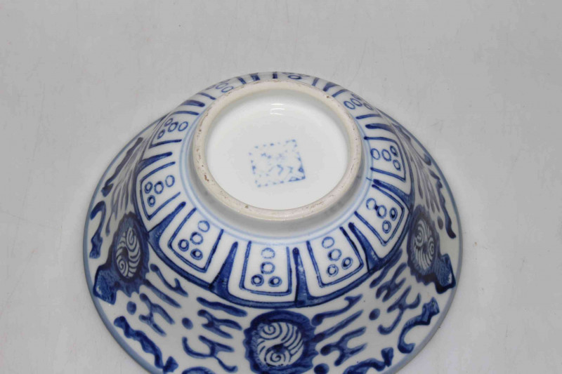 Chinese blue and white bowl with carved wood stand, 16.5cm diameter.