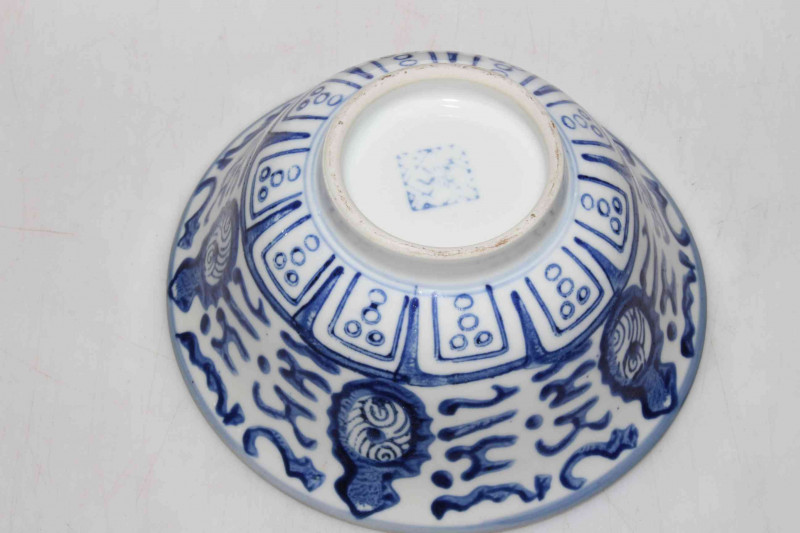 Chinese blue and white bowl with carved wood stand, 16.5cm diameter.