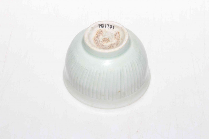 Chinese Sony Dynasty Qingbai tea bowl with vertical line decoration, collectors reference to base, 8.5cm diameter.