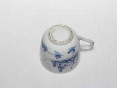 19th Century Oriental pottery blue and white cup decorated with trees and flowers. thumbnail