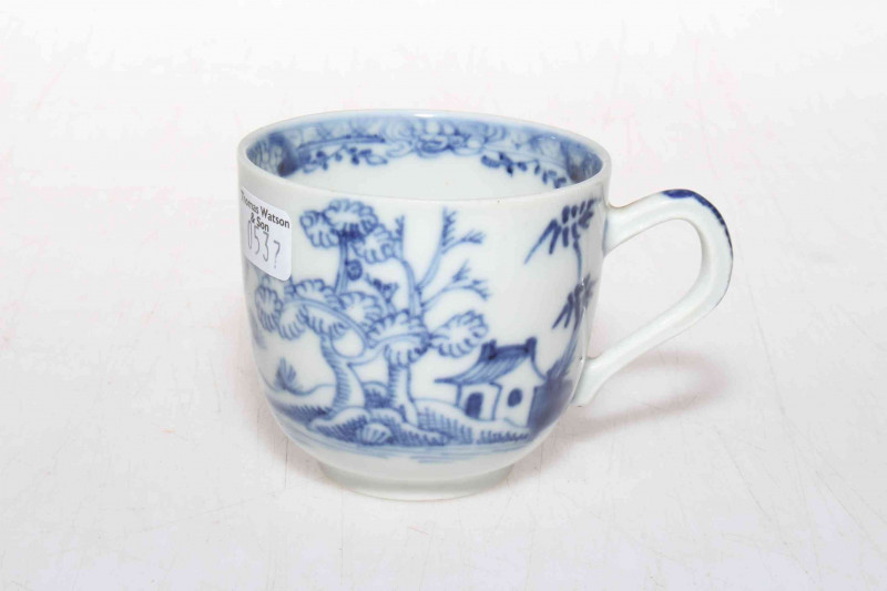19th Century Oriental pottery blue and white cup decorated with trees and flowers.