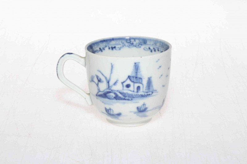 19th Century Oriental pottery blue and white cup decorated with trees and flowers.