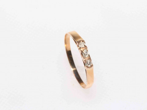 Gold three stone diamond ring, size O.