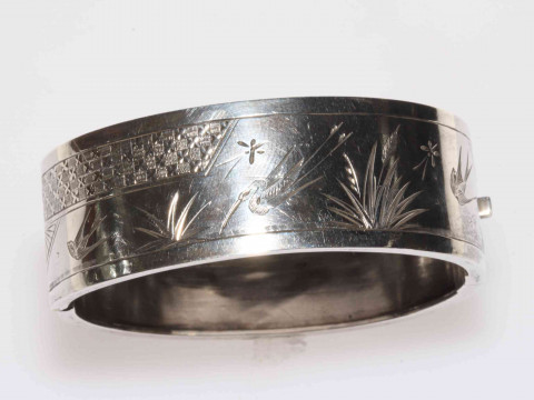 Silver hinged bangle with engraved decoration, 22mm wide.