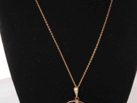 9 carat gold, sapphire and seed pearl pendant brooch with fine chain.