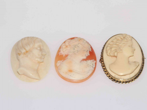 Two ivory brooches and unmounted cameo (3)