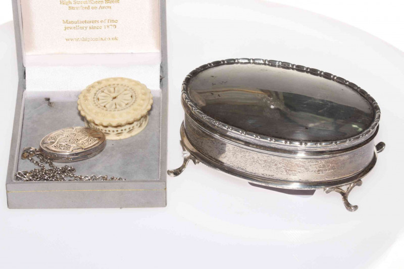 Silver oval ring box, London 1909 (lid loose), silver locket and small ivory box with roundels (3).