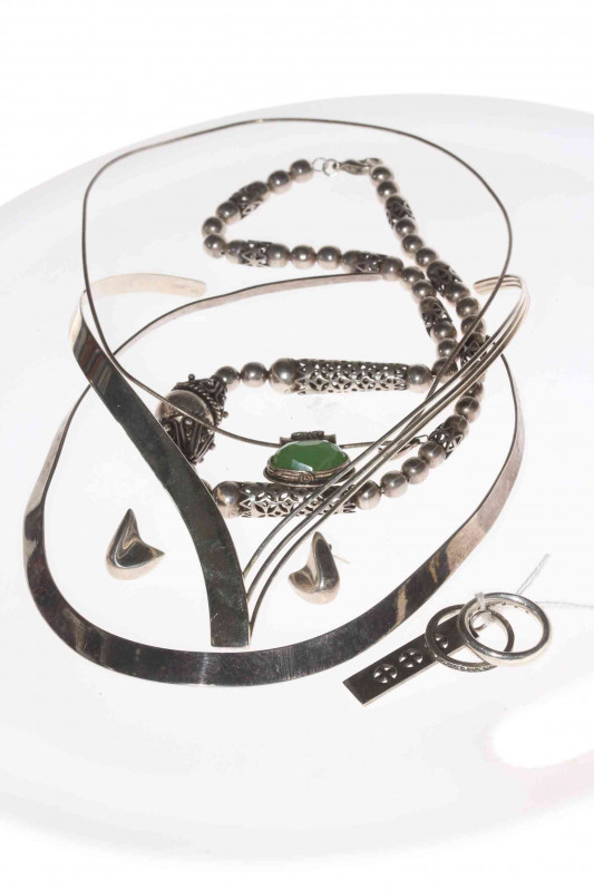 Box with silver jewellery including stylish neck pieces.