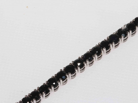 Sapphire line bracelet set in 18 carat white gold, having 53 sapphires totalling 7.5 carat, 18cm length. thumbnail