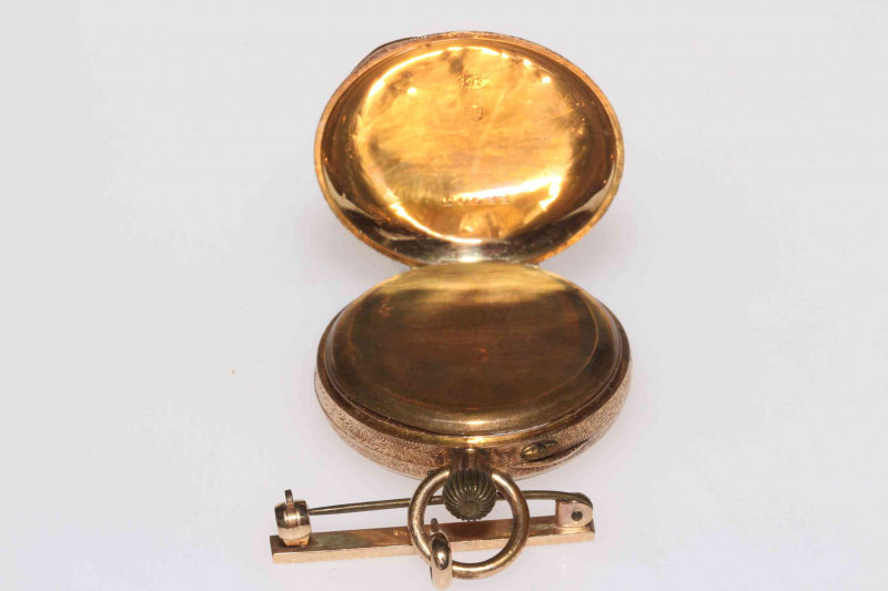 14k gold keyless fob watch with 9 carat gold bar brooch.