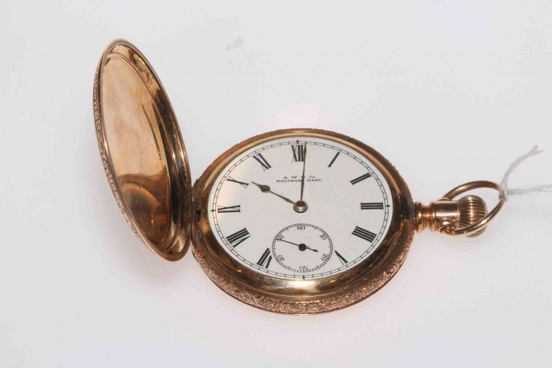 Waltham keyless hunter in ornate decorated case.