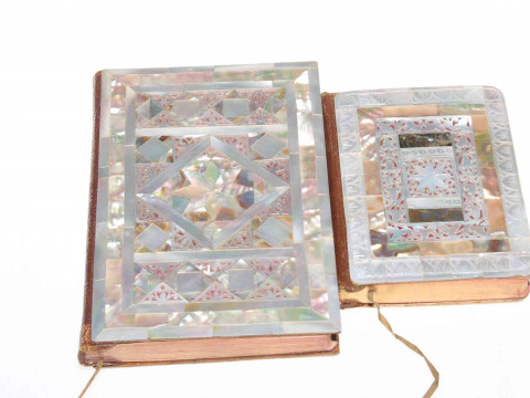 Two ornate mother of pearl veneered New Testament books, largest 16cm...