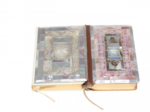 Two ornate mother of pearl veneered Prayer books, largest 12cm by 8.5cm.