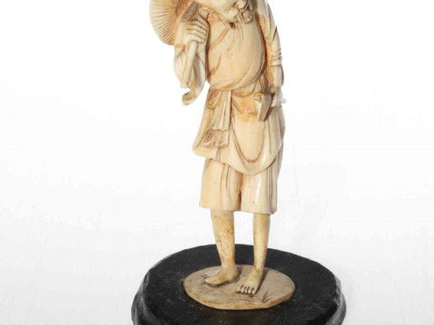 Japanese ivory figure of a wood cutter, circa 1900, 16cm.