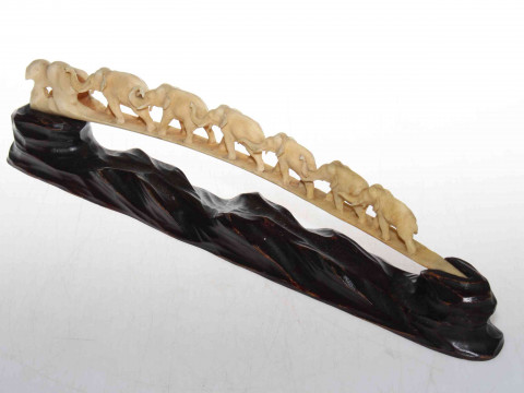 Japanese ivory bridge of graduated elephants on wood stand, circa 1920's,...