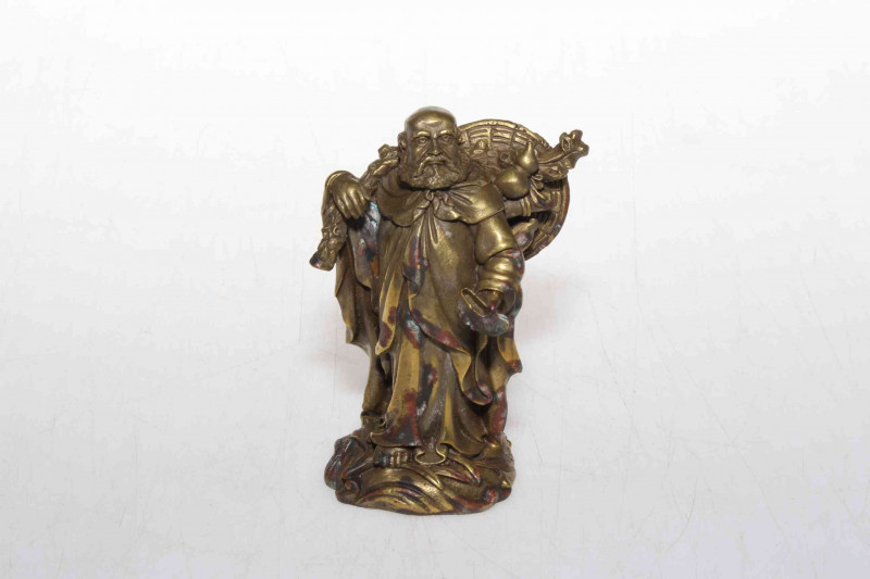 Chinese gilt bronze travelling elder, 9.5cm.