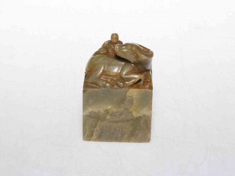 Chinese soapstone/marble carving of figure on water buffalo, 8cm.