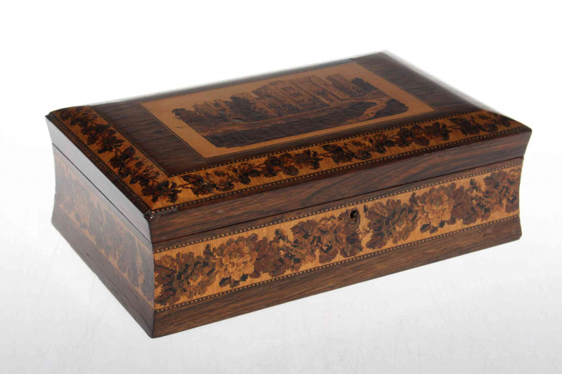 19th Century Tunbridge ware box, having castle decoration to lid with foliate borders on rosewood, 25cm across.