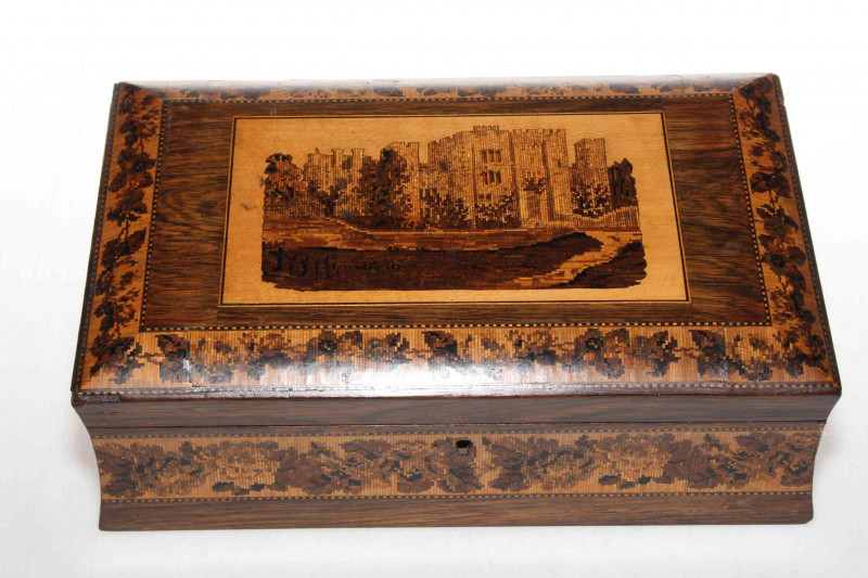 19th Century Tunbridge ware box, having castle decoration to lid with foliate borders on rosewood, 25cm across.