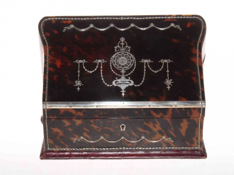Good silver inlaid tortoiseshell stationery box, the sloping lid inlaid with garlands and revealing fitted interior, 29cm wide, 20cm high. thumbnail