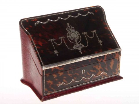 Good silver inlaid tortoiseshell stationery box, the sloping lid inlaid...