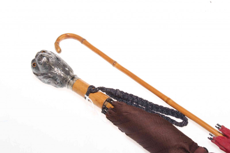 Umbrella with chased King Charles Spaniel handle, and a parasol (2).