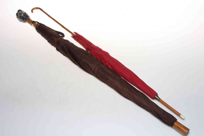 Umbrella with chased King Charles Spaniel handle, and a parasol (2).