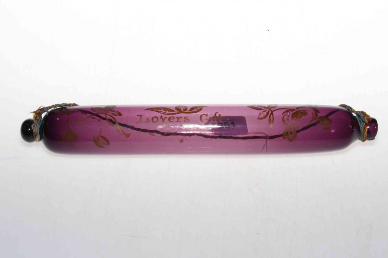 19th Century amethyst glass 'Lovers Gift' rolling pin, 37cm long.