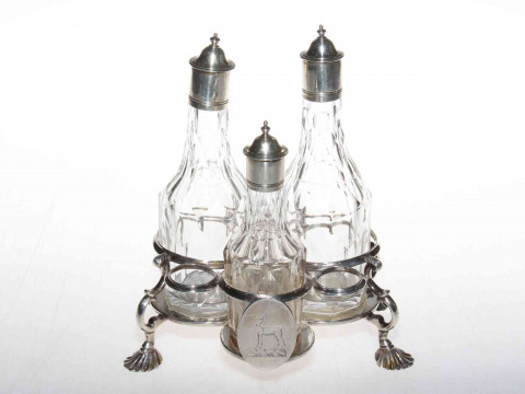 George III silver Warwick three bottle cruet on shell feet, makers mark...