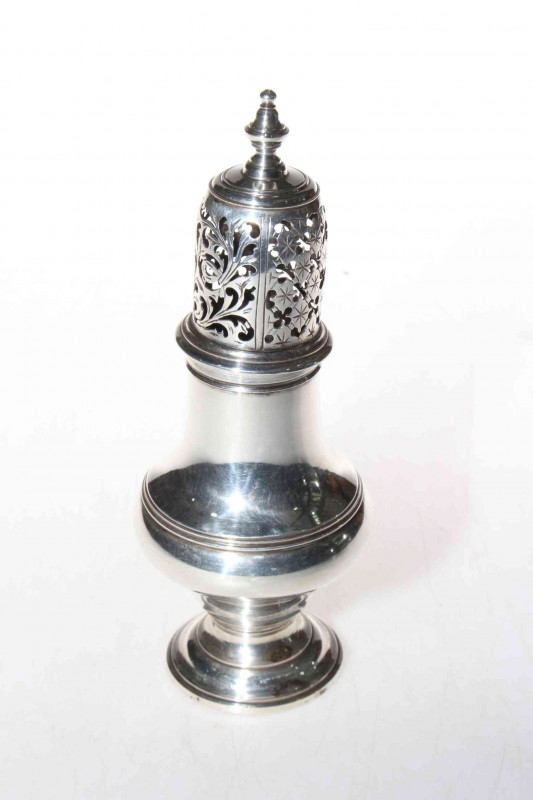 George III silver caster of baluster form, makers mark I.M, London 1776, good hallmarks to base and cover, 16cm.