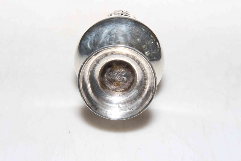 George III silver caster of baluster form, makers mark I.M, London 1776, good hallmarks to base and cover, 16cm.