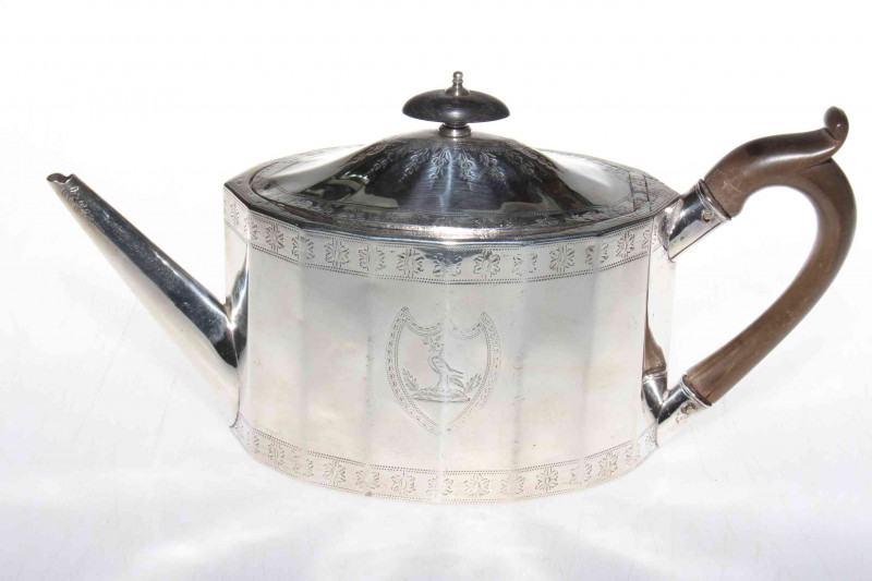 George III silver teapot by Foglebery & Gilbert, London 1756, having panelled oval body with bright-cut decoration, 28cm across, 15toz gross.