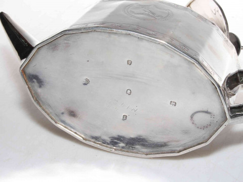 George III silver teapot by Foglebery & Gilbert, London 1756, having panelled oval body with bright-cut decoration, 28cm across, 15toz gross. thumbnail